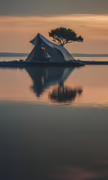 a small tent on top of the water