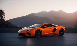 an orange sports car sits in the dark
