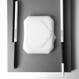 some white objects are sitting on a grey surface