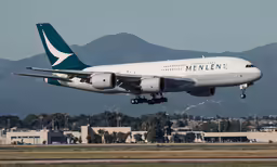 a large air plane flying through the air