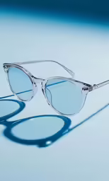 sunglasses with a clear frame and some light blue sun glasses