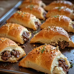 a large pile of stuffed meat bread