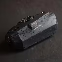 a black and gray camera with lots of rust