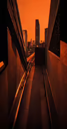 orange sky above an urban street at sunset