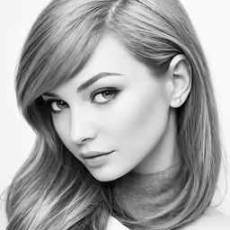 a young woman with blonde hair, looking to the side