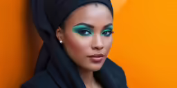 a beautiful woman wearing a black hijab and a scarf