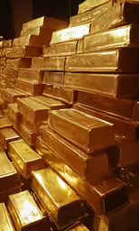 golden bars are lined up in a room