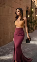 a model walking down the street in a purple midi skirt