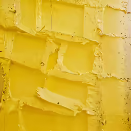 yellow paint is smeared from a yellow background