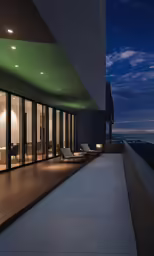 large windows overlook the night skyline with the moon