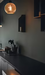 a table with a light bulb hanging from it