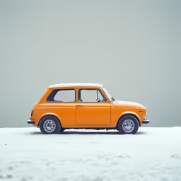 an orange car is parked in the snow