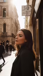 a woman standing in an alleyway next to buildings
