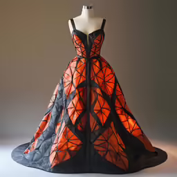 a dress made out of black, orange and gray fabric