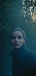 the young woman is staring at the camera