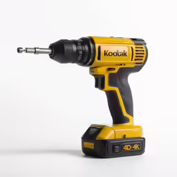 a corded power drill sitting on top of a white surface