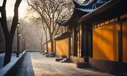 the sun is going down on an asian building