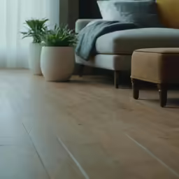 a white floor and some couches with pillows