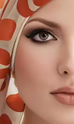 an elegant woman with brown eyes and an orange scarf