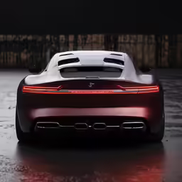 the back of a sports car in a dark garage