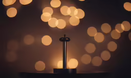 the cross is standing at the end of a table