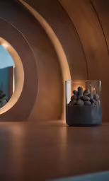 a glass container full of small pebbles sitting on a counter