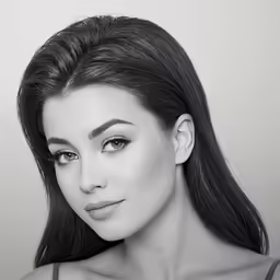 a black and white photo of a woman in bra top