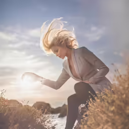 an image of a woman outdoors holding her pants