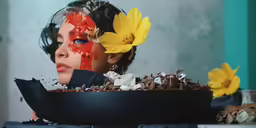 a woman with painted her face in an artistic manner