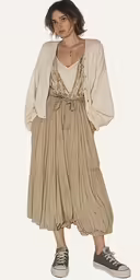 woman in a long dress posing for the camera