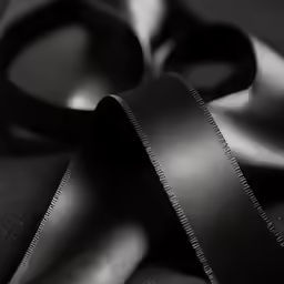a black ribbon on top of a table