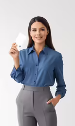 a woman posing for a photo in a blue shirt
