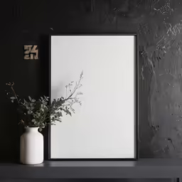 a black and white vase and mirror against the wall