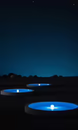 blue lights glowing up on a dark desert landscape