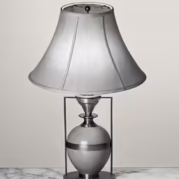 lamp with gray base on marble table top
