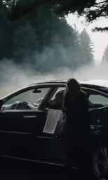 a woman entering her car by the window