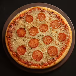 there is an uncut pizza on the plate