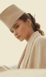a woman with a white hat in her hair