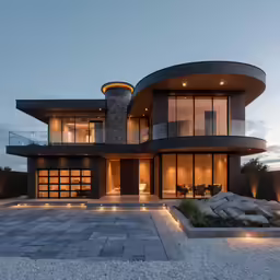 a modern style home lit up at dusk