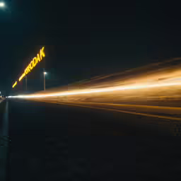 a road with some street lights near a building