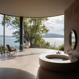 there is a circular bathroom with a tub and mirror
