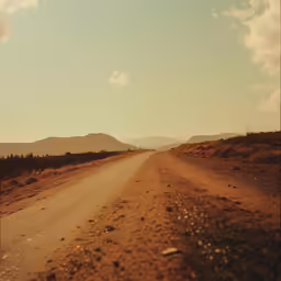 the dirt road is empty and partly deserted
