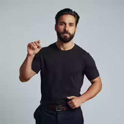 a man standing with his hand in his pocket