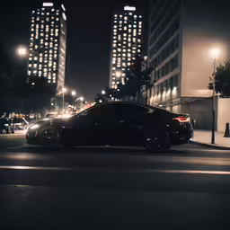 black and white photograph of cars stopped at a city intersection