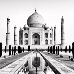 a monument with a large pool in front