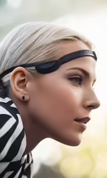 woman with blonde hair and glasses, wearing the sun visor