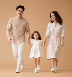 a young family walking while holding hands