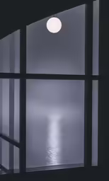 a window looking out onto the ocean
