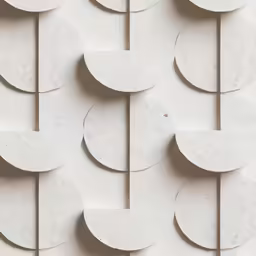 a wall covered in lots of shapes like circles