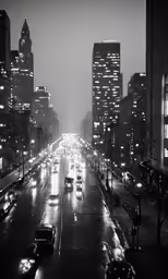 black and white photograph of traffic at night